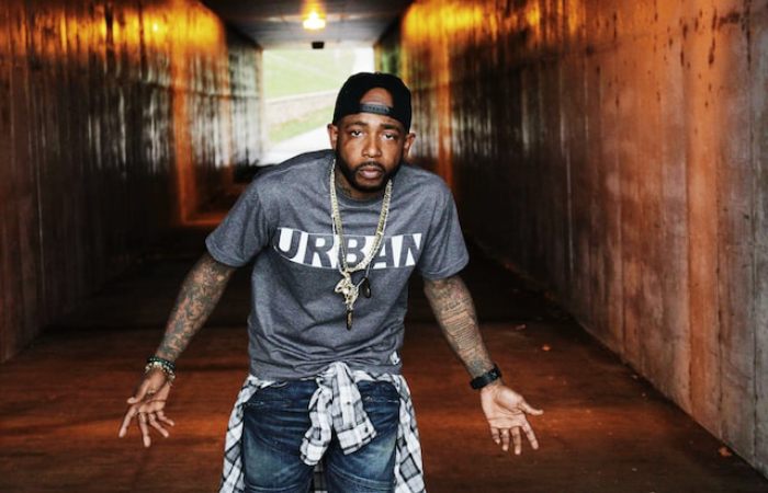 Why do Rappers Raise four fingers?